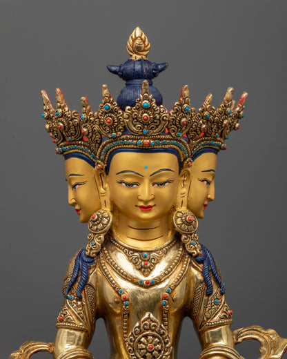 Close-up of Vairocana Buddha Statue showing three heads, five-jewel crown