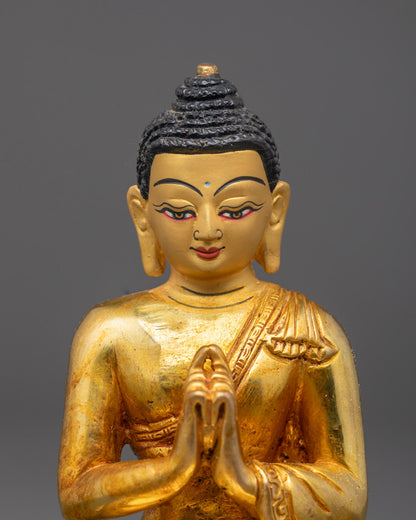Close-up of Vairocana Buddha’s gold Fire-gilded body seated on chos khri throne with mudra pose.