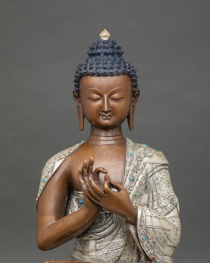 Close-up of Vairocana Buddha statue with oxidized finish and silver details, Patan Nepal craftsmanship