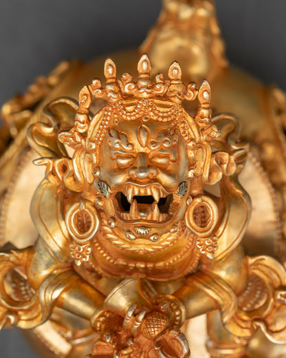 Close-up of Vajradhaka Buddha face showing fangs and fierce protective expression