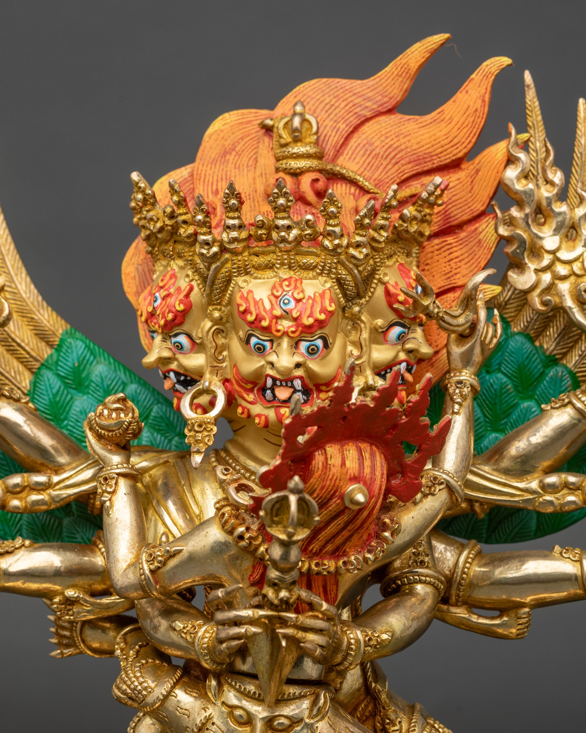 Close-up of Vajrakilaya statue showing detailed copper and gold fire-gilded features