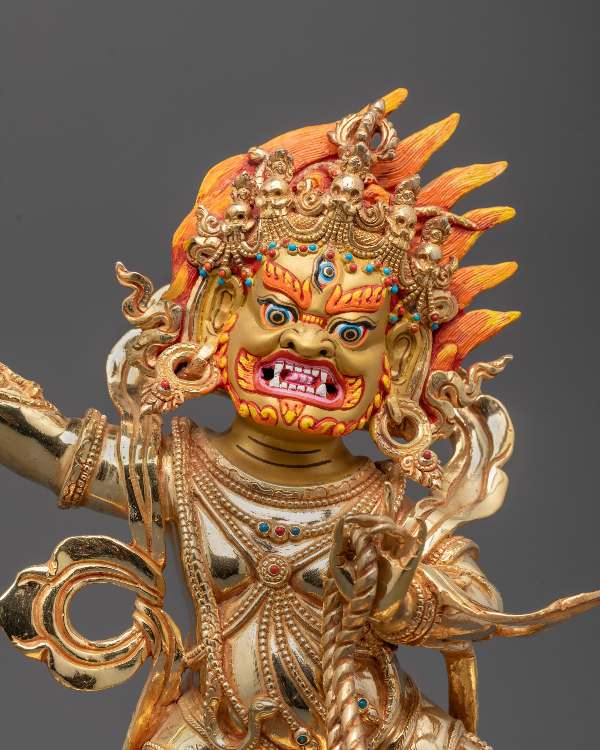 Close-up of Vajrapani Statue showing 24k gold fire gilding and semi-precious stone