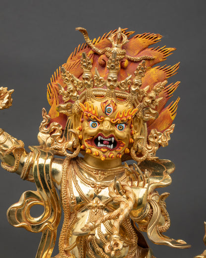 Close-up of Vajrapani Statue showing detailed gold-painted face and intricate ornaments