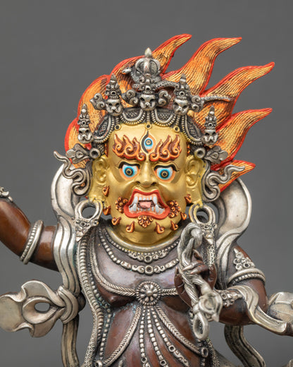 Close-up of Vajrapani face with 24K gold-painted details and fierce expression