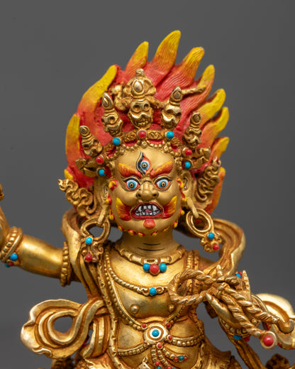 Close-up of Vajrapani holding vajra with intricate flame halo behind