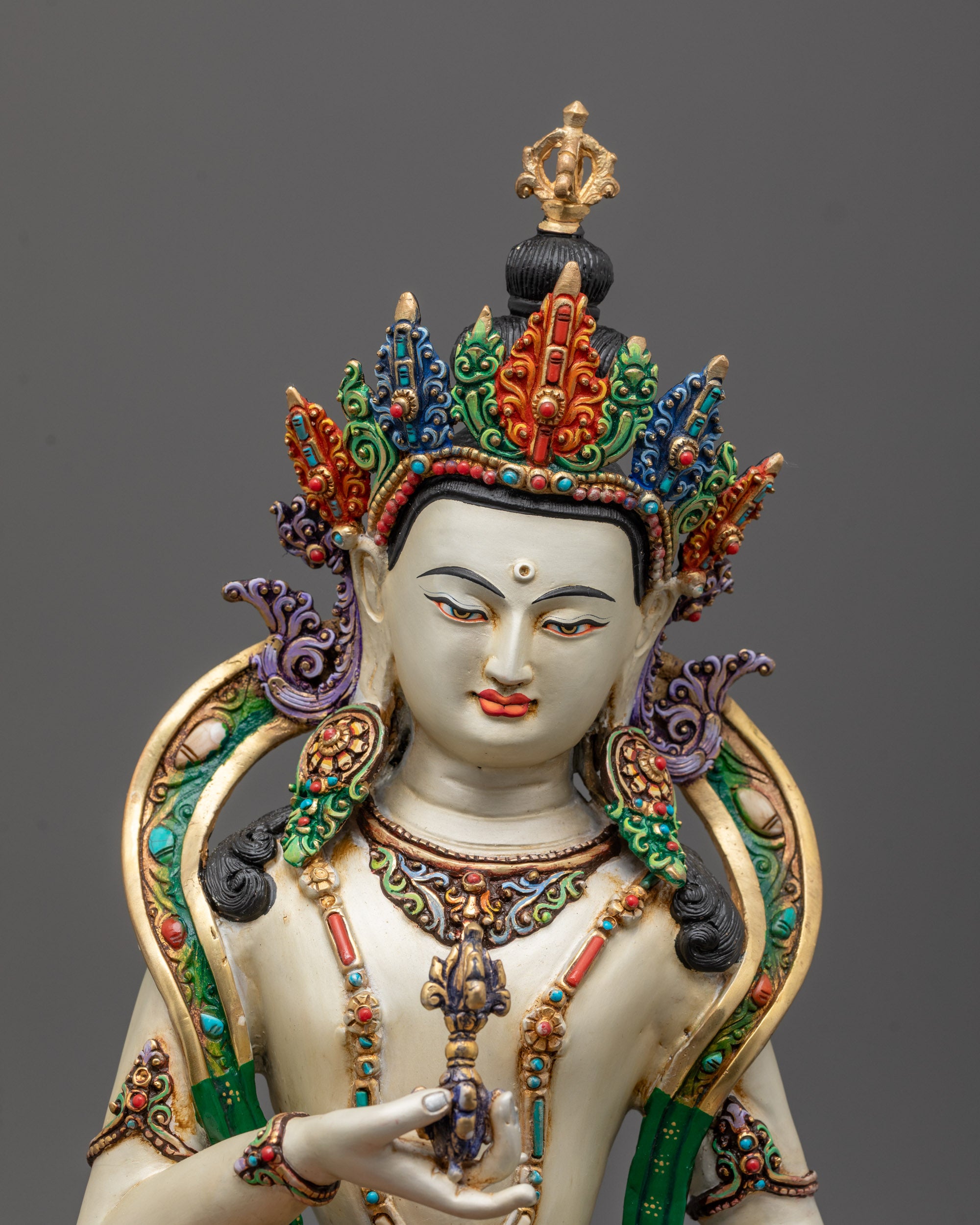 Close-up of Vajrasattva Statue face polished with white acrylic color