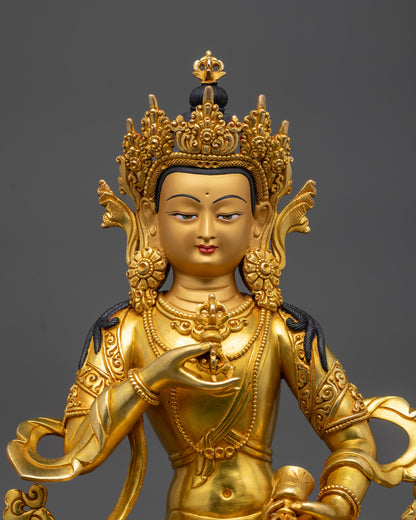 Close-up of Vajrasattva face and intricate robe patterns in lost wax Buddhist artwork