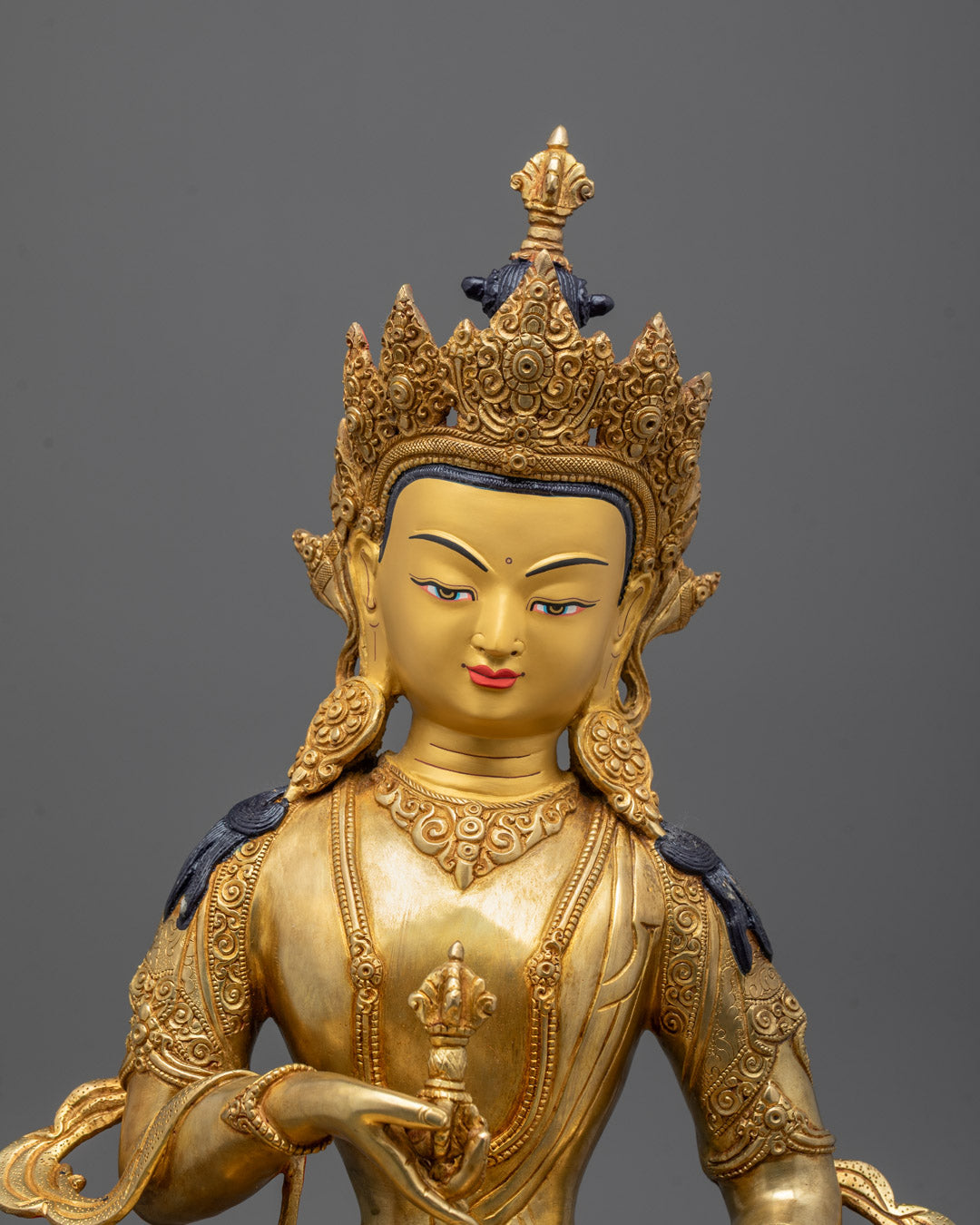 Close-up of Vajrasattva’s serene face and intricate crown detail