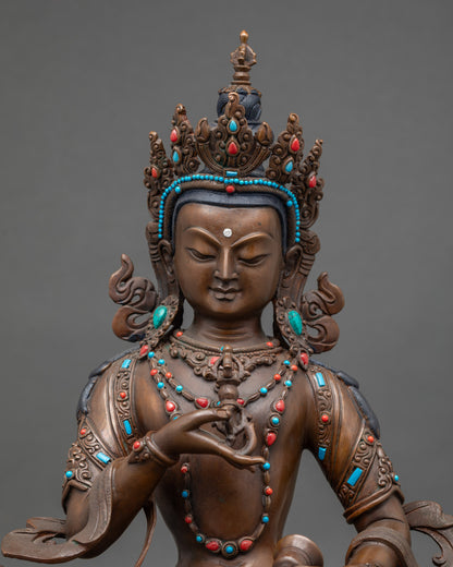 Close-up of Vajrasattva statue showing intricate semi-precious stone details