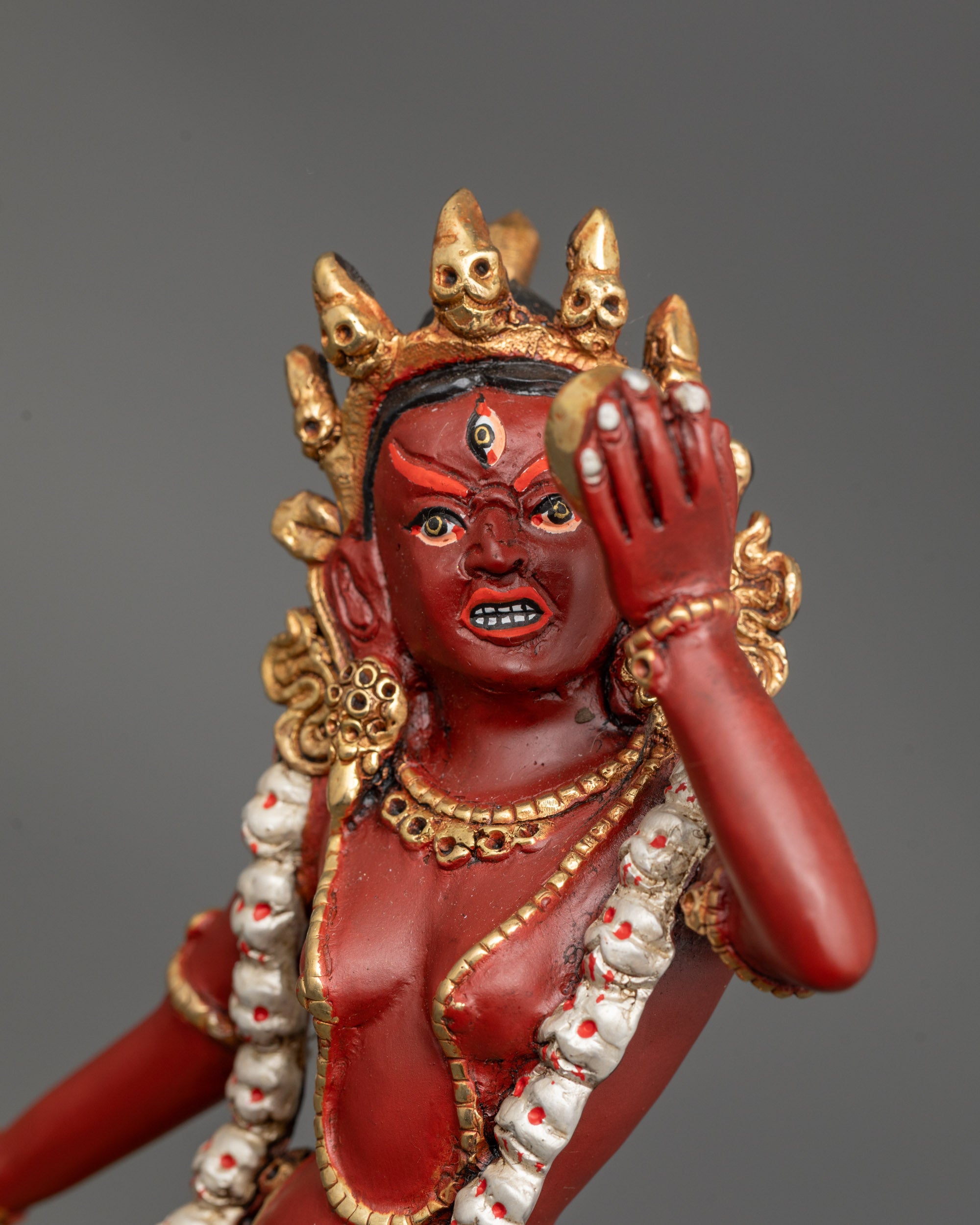 Close-up of Vajrayogini Statue holding curved knife with vajra and skull cup