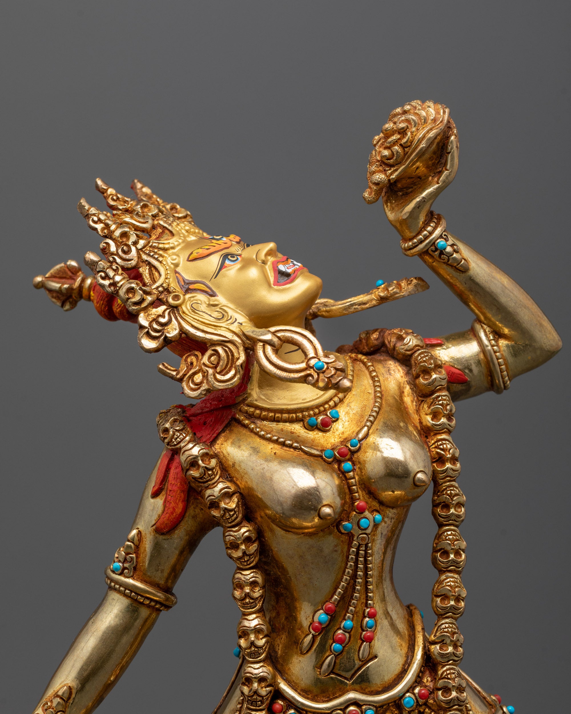 Close-up of Vajrayogini's Mundamala garland and semi-precious stone robe details