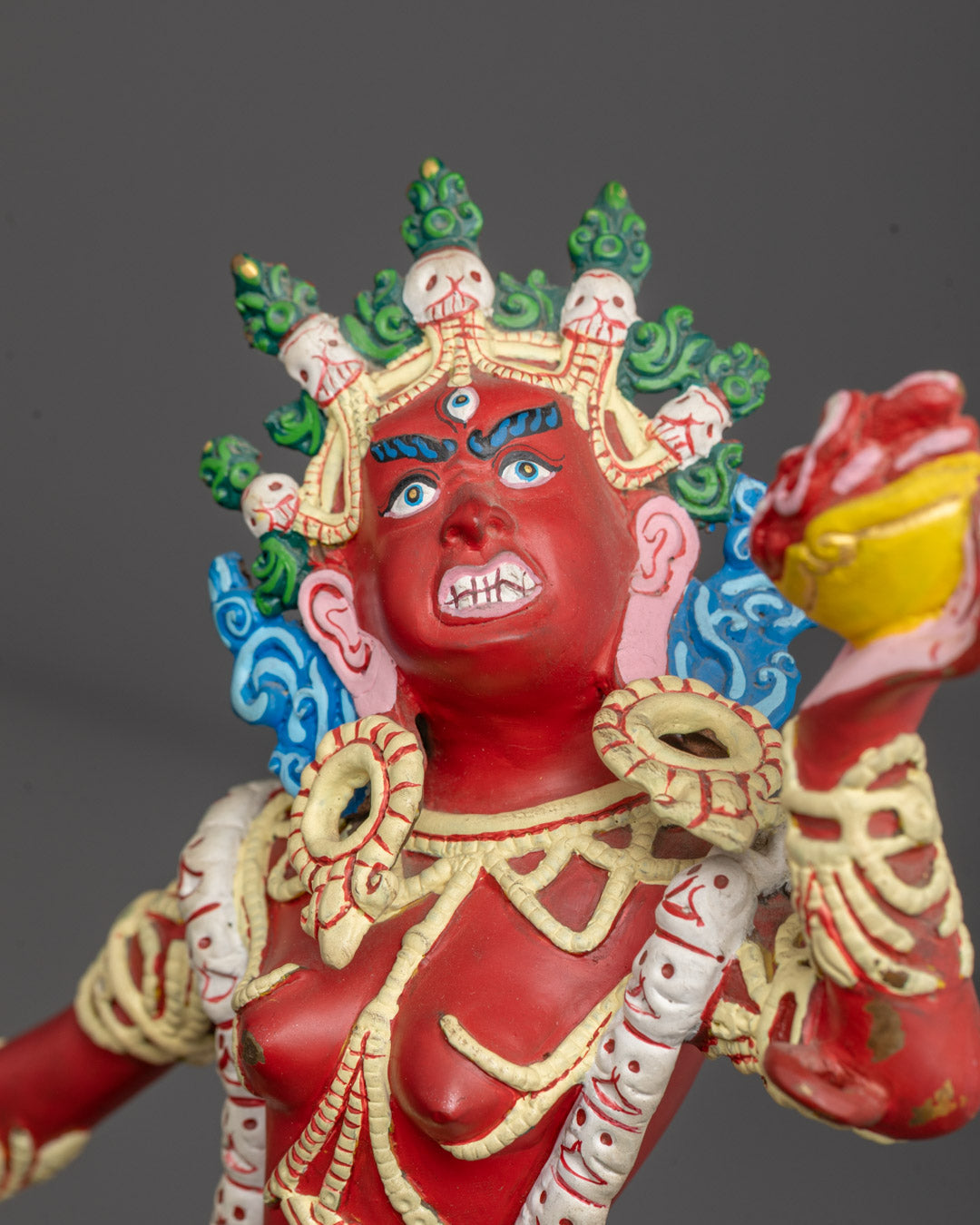 Close-up of Vajrayogini’s serene face and intricate ornamentation, showcasing traditional Himalayan
