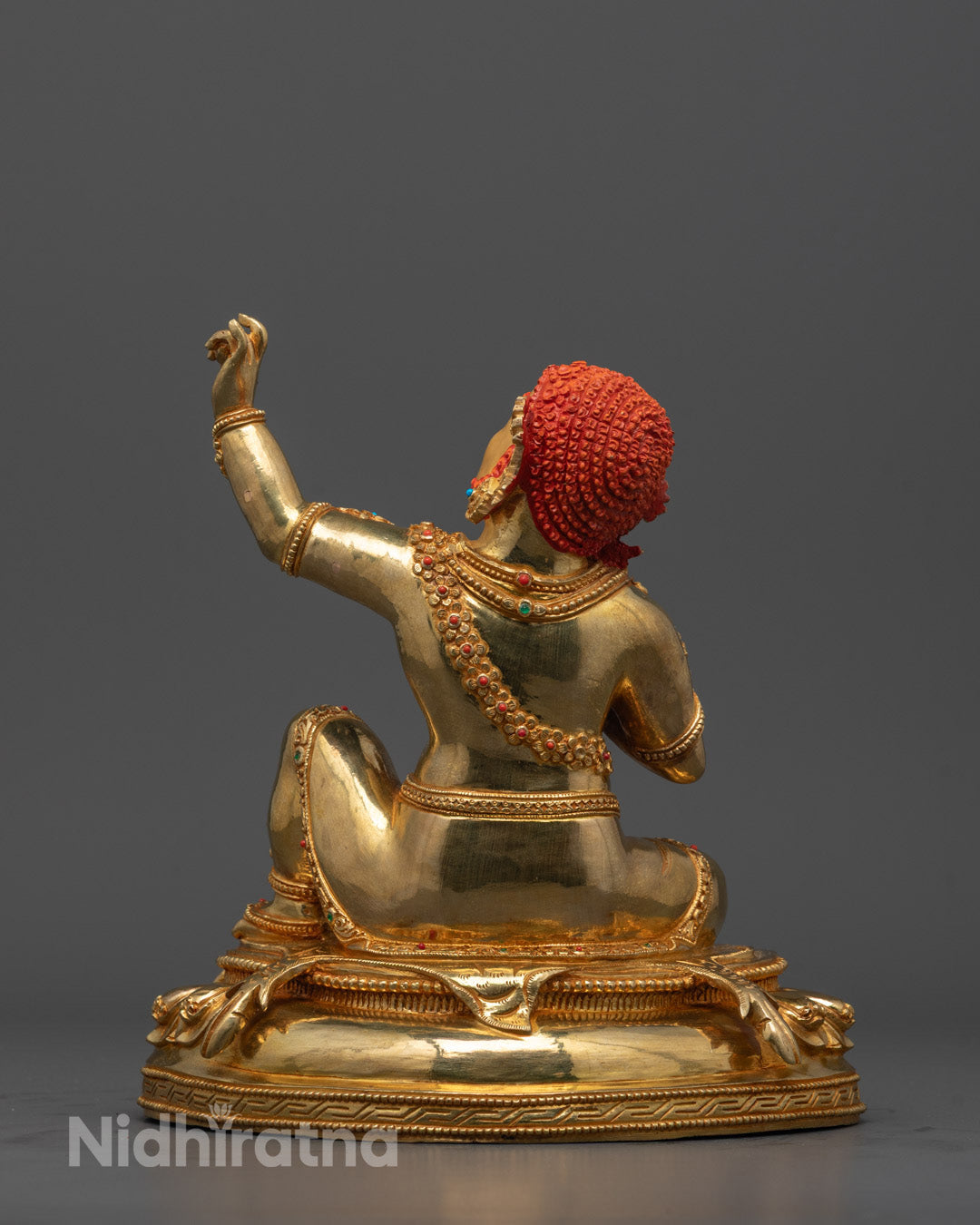 Close-up of Virupaksha’s fierce face and gold-plated 