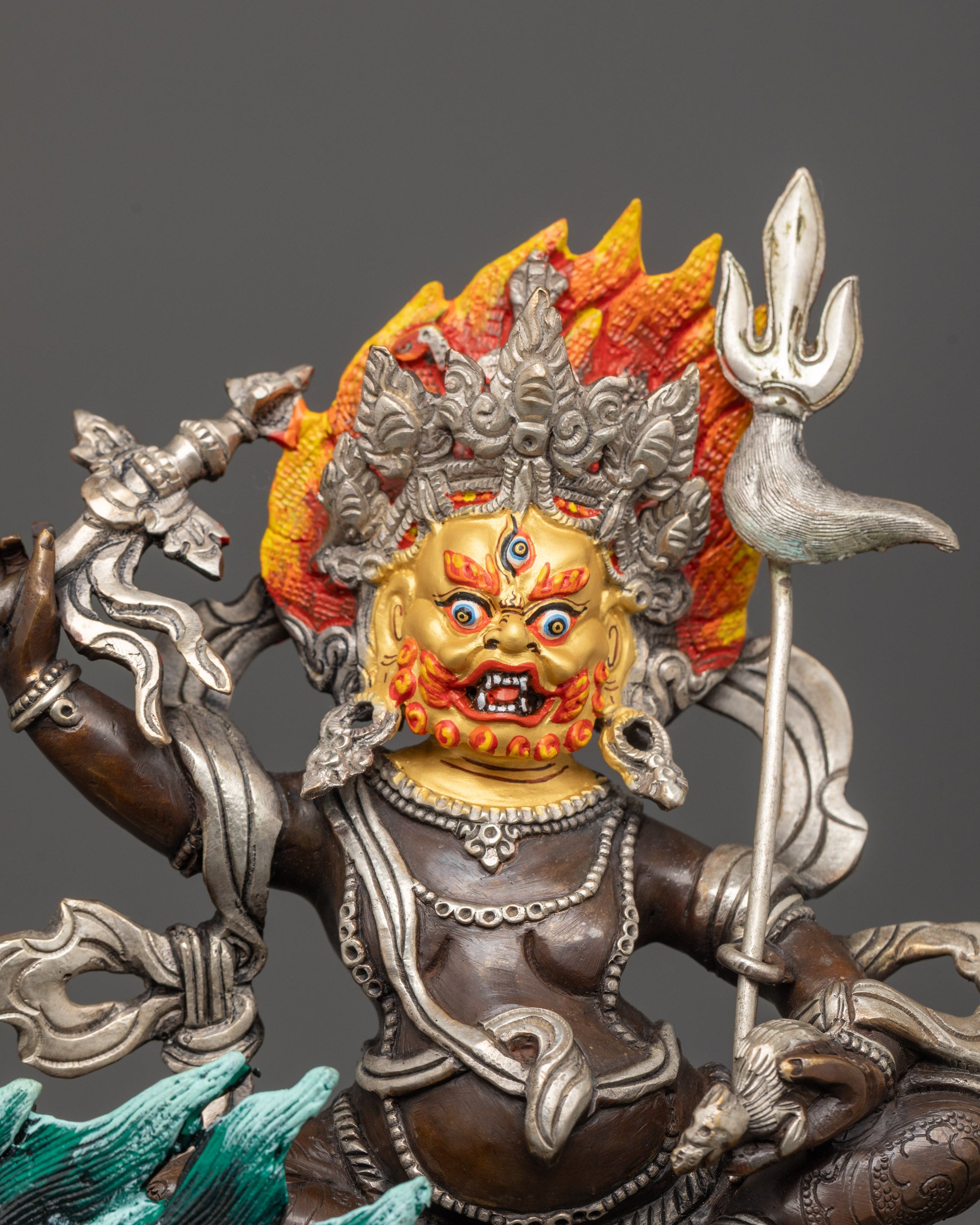 Close-up of White Dzambhala’s silver-plated floating robe and intricate jewelry details.
