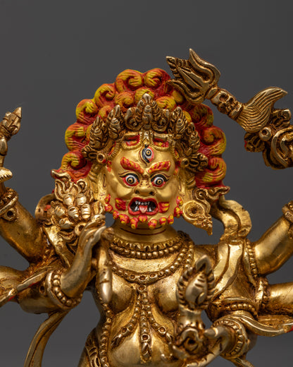 Close-up of White Mahakala’s fierce face with radiant gold finish and intricately carved crown