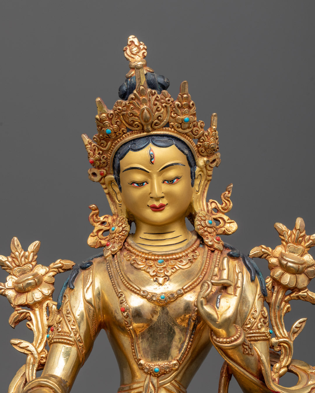 Close-up of White Tara Sculpture’s gold fire-gilded body and semi-precious stones