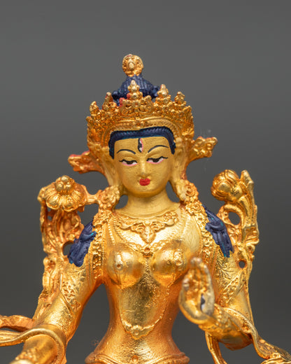 Close-up of White Tara face with gold paint and serene seven-eyed detail
