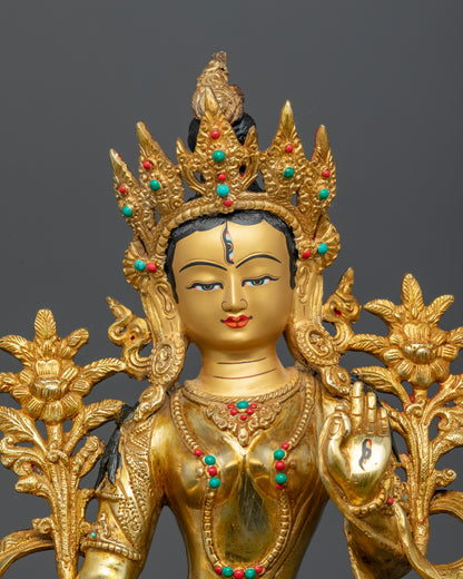 Close-up of White Tara’s face showing 24K gold-painted features and serene expression