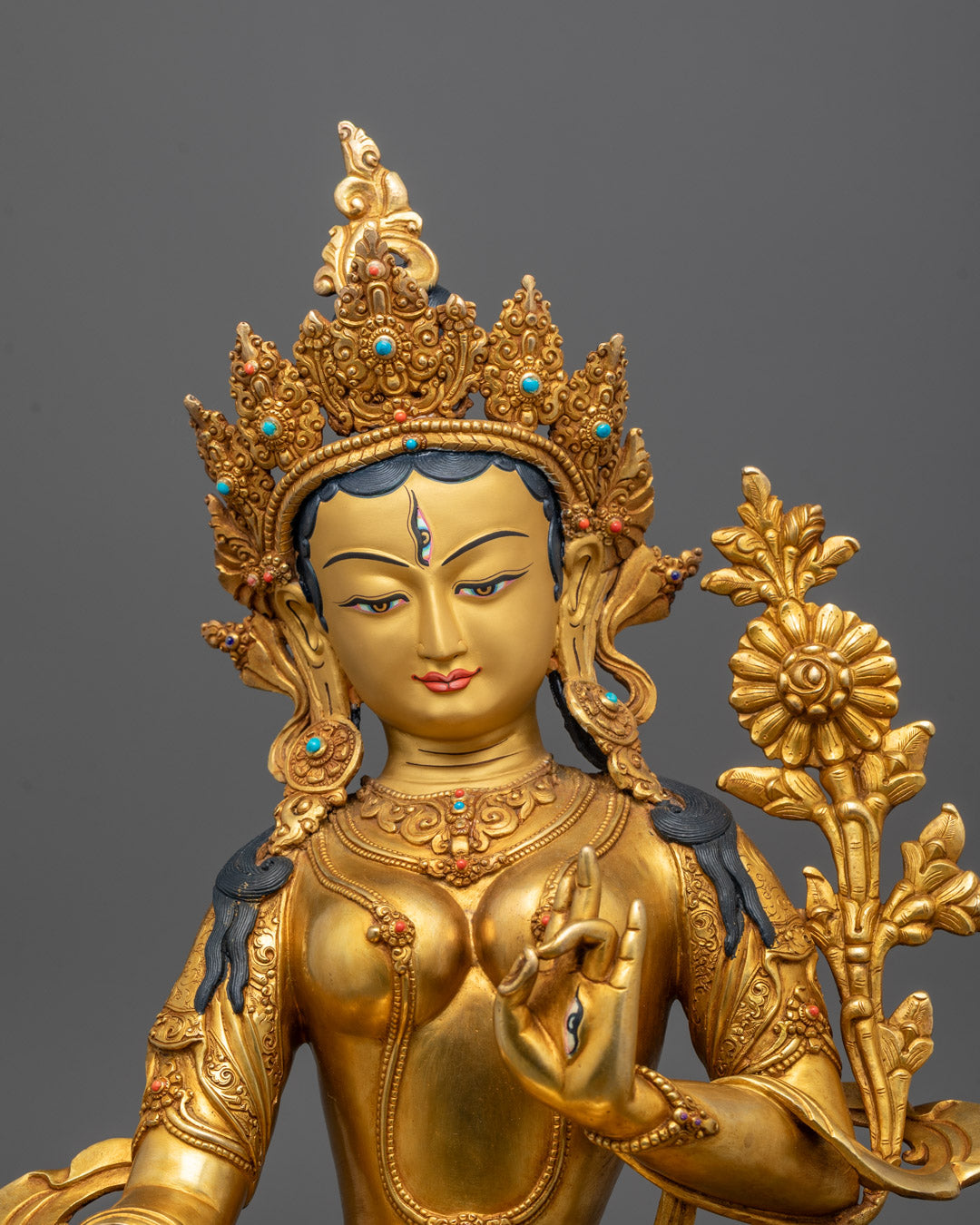Close-up of White Tara’s serene face and crown showing intricate details
