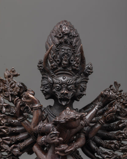 Close-up of Yamantaka face and consort in oxidized copper with ritual detailing