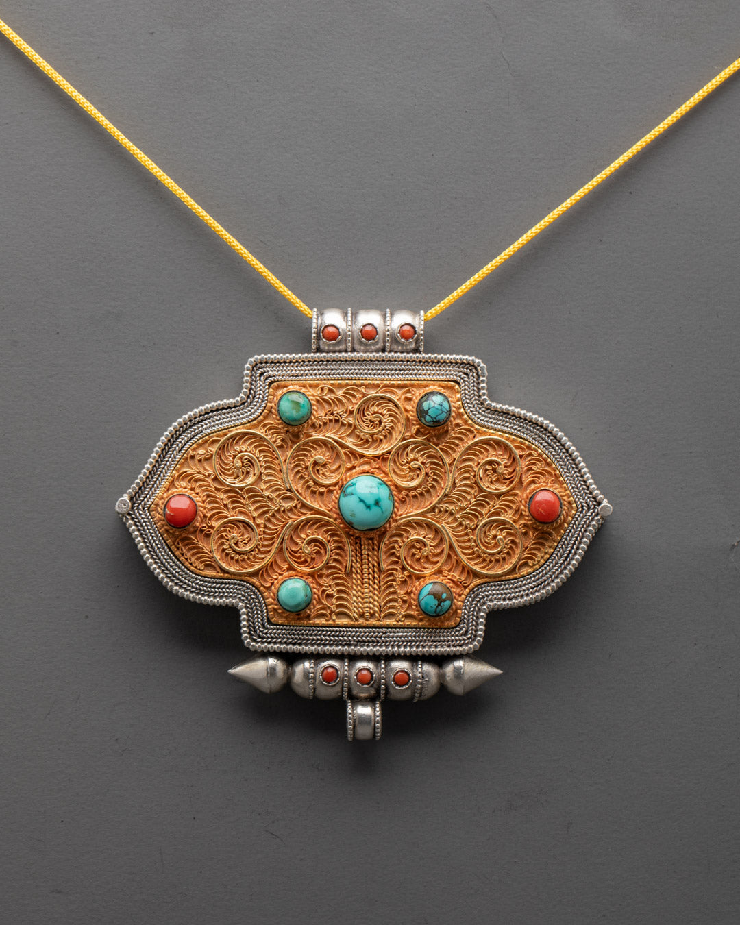 Close-up of a hand-carved Ghau Box Locket made of Gold-plated copper