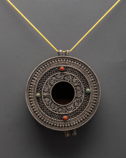Close-up of a silver-plated Mandala Locket adorned with colorful semi-precious stones