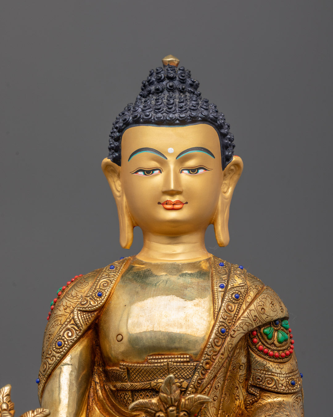 Close-up of a traditional Nepalese Medicine Buddha statue showcasing