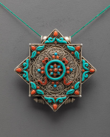 Close-up of coral and turquoise stones on handcrafted Dharma Wheel Locket