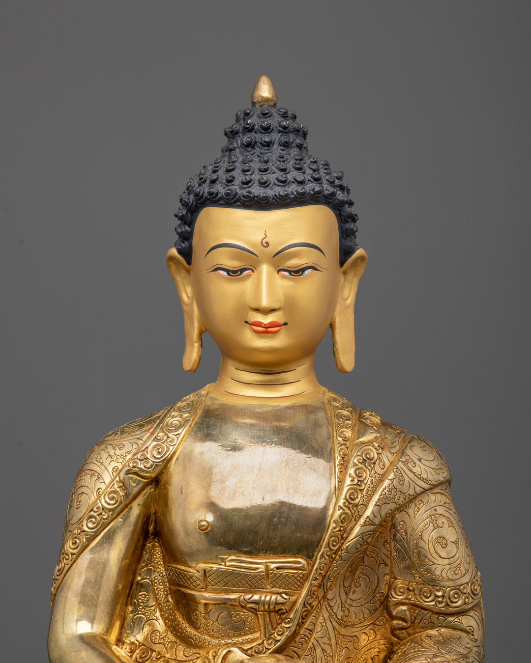 Close-up of detailed 24k gold gilding on Amitabha Buddha copper statue