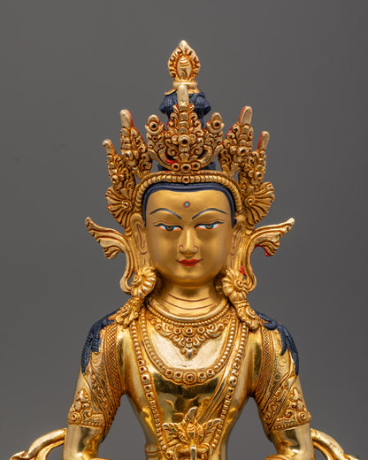detailed Amitayus Buddha statue showing intricate fire-gilded gold craftsmanship and vibrant colors.