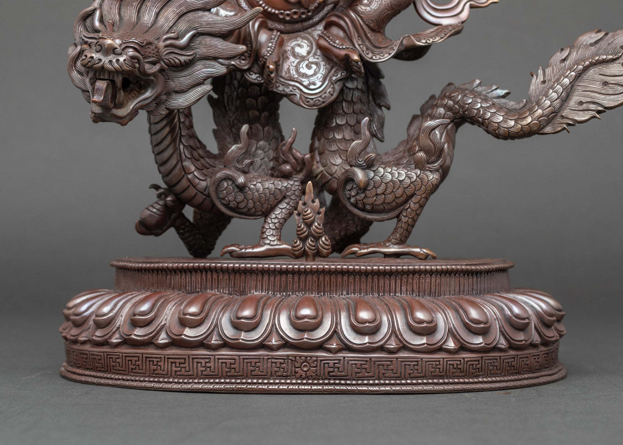 Close-up of dragon base and intricate lotus throne, handmade Nepalese White Dzambhala