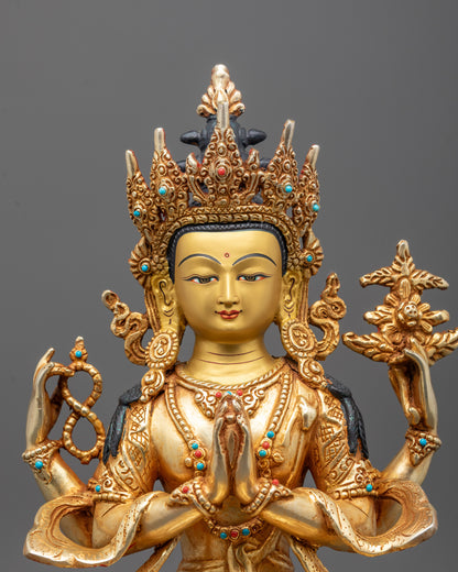 Close-up of fire-gilded detailing on Chenrezig's serene face