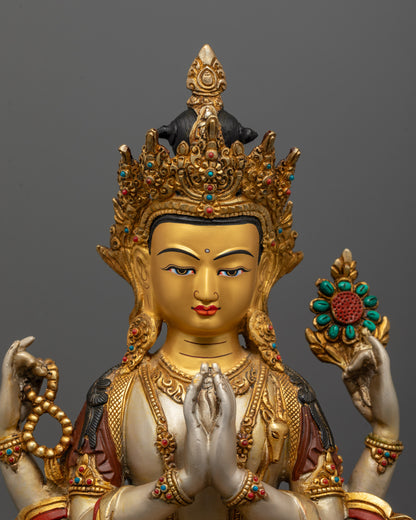 Close-up of four-armed Chenrezig Bodhisattva holding symbolic objects