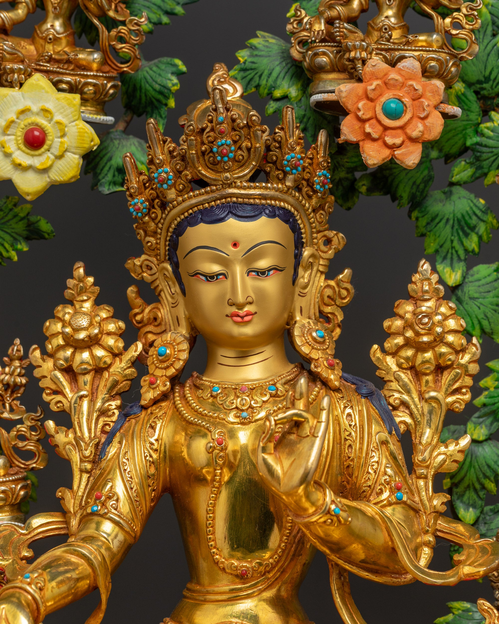 Close-up of gold fire-gilded Tara figures crafted by Newari artisans from Patan Nepal
