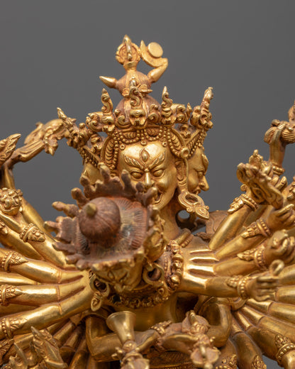 Close-up of golden Kalachakra statue featuring detailed halo and intricate carvings