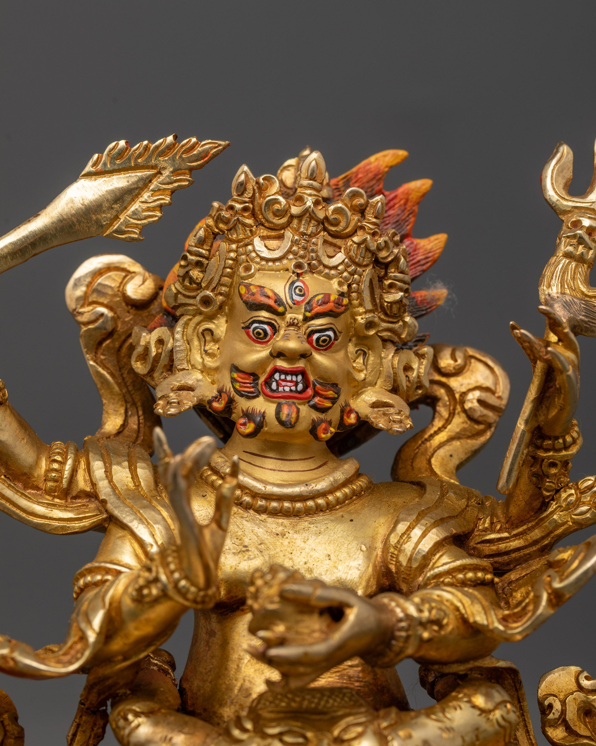 Close-up of hand-carved Four Armed Mahakala Consort Statue