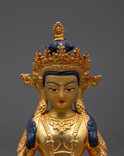 Close-up of handcrafted Amitayus Buddha statue featuring radiant 24k gold finish