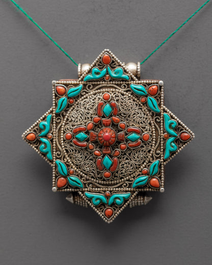 Close-up of handcrafted Bishwo Vajra Locket with silver filigree design