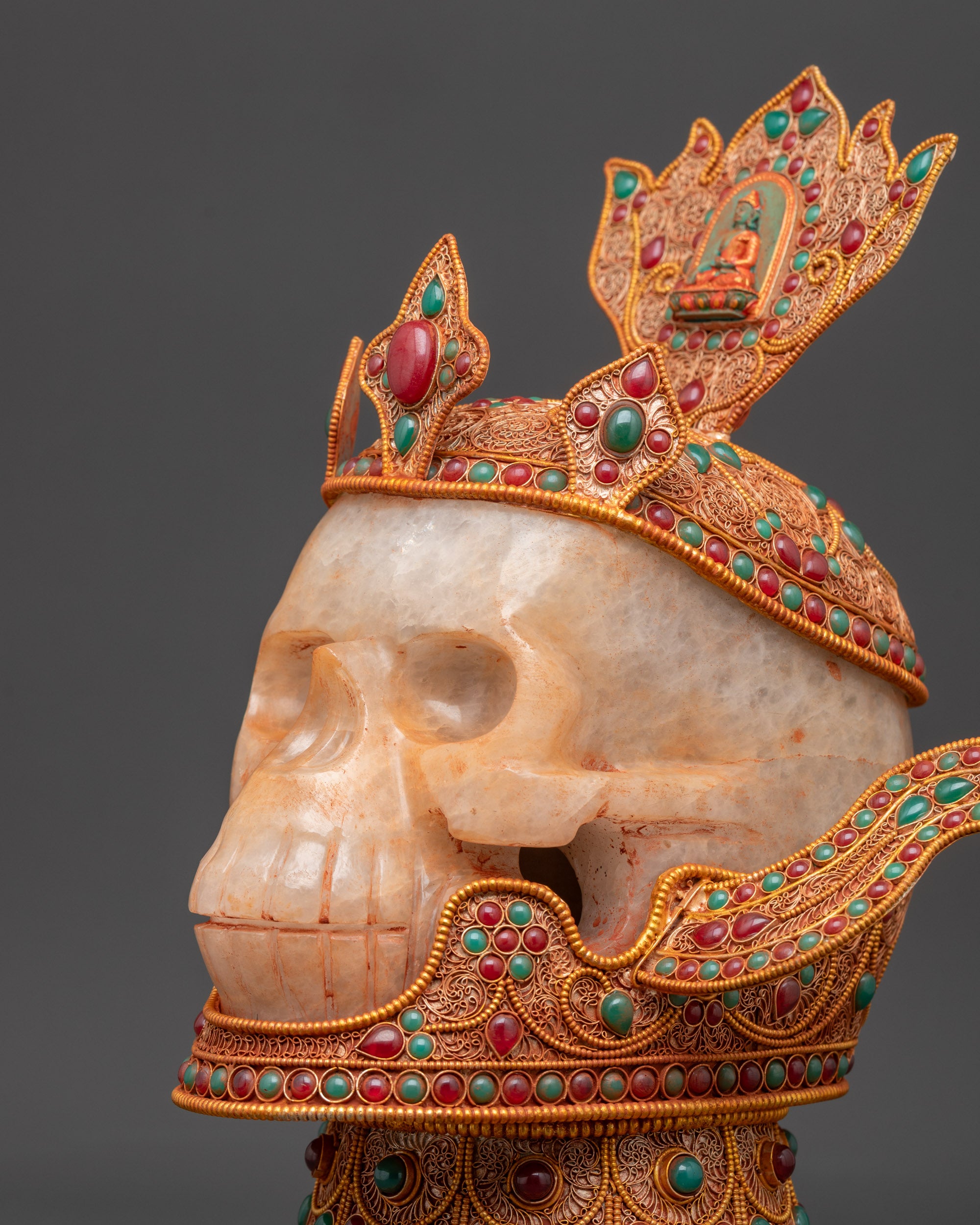 Close-up of handcrafted Jeweled Skull Head showing detailed gemstone inlays