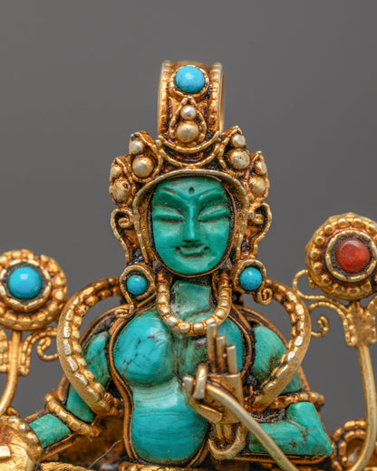 Close-up of handmade Green Tara Locket adorned with semi-precious stones
