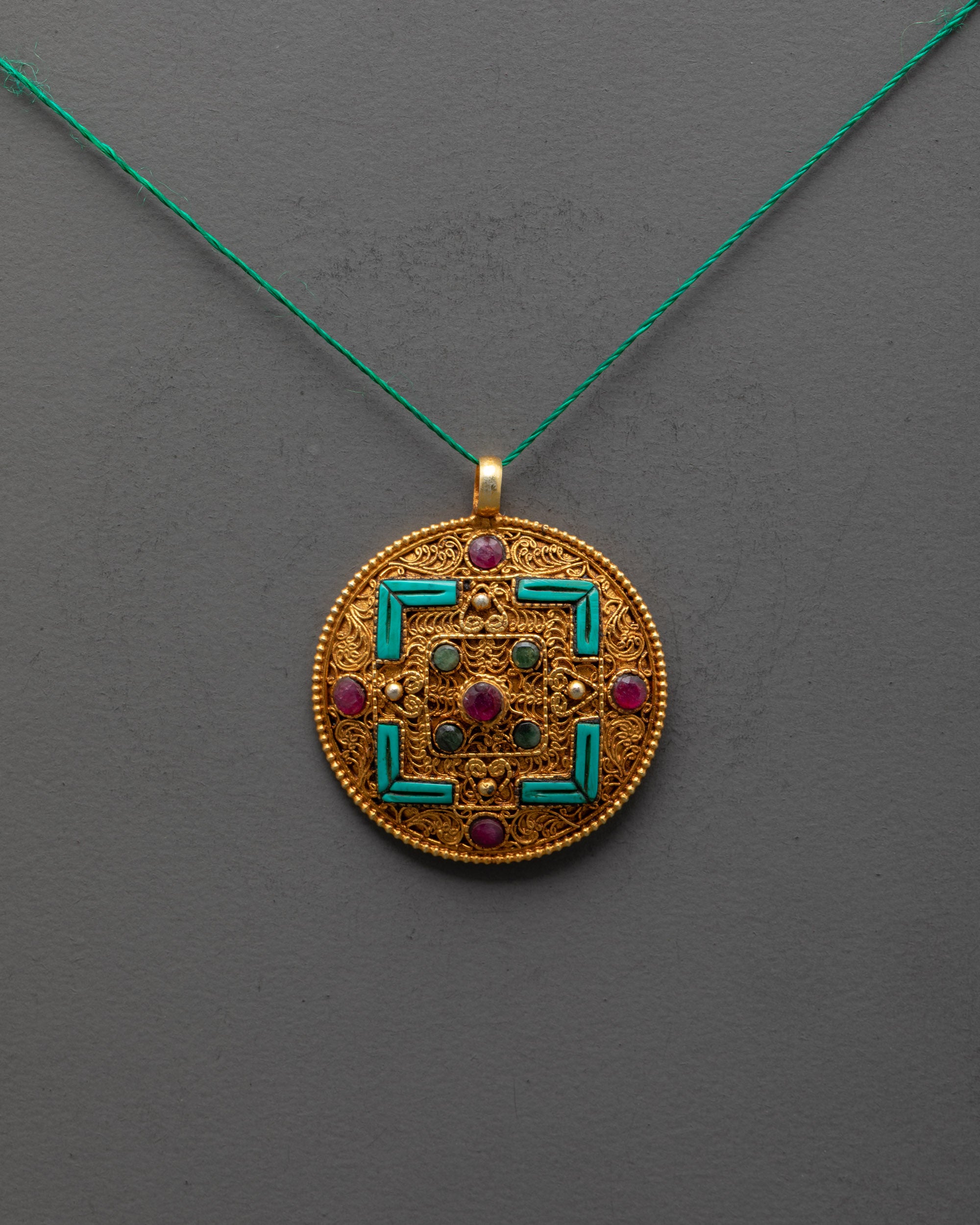 Close-up of intricate Mandala Pendant showing gemstone details and artisan metalwork