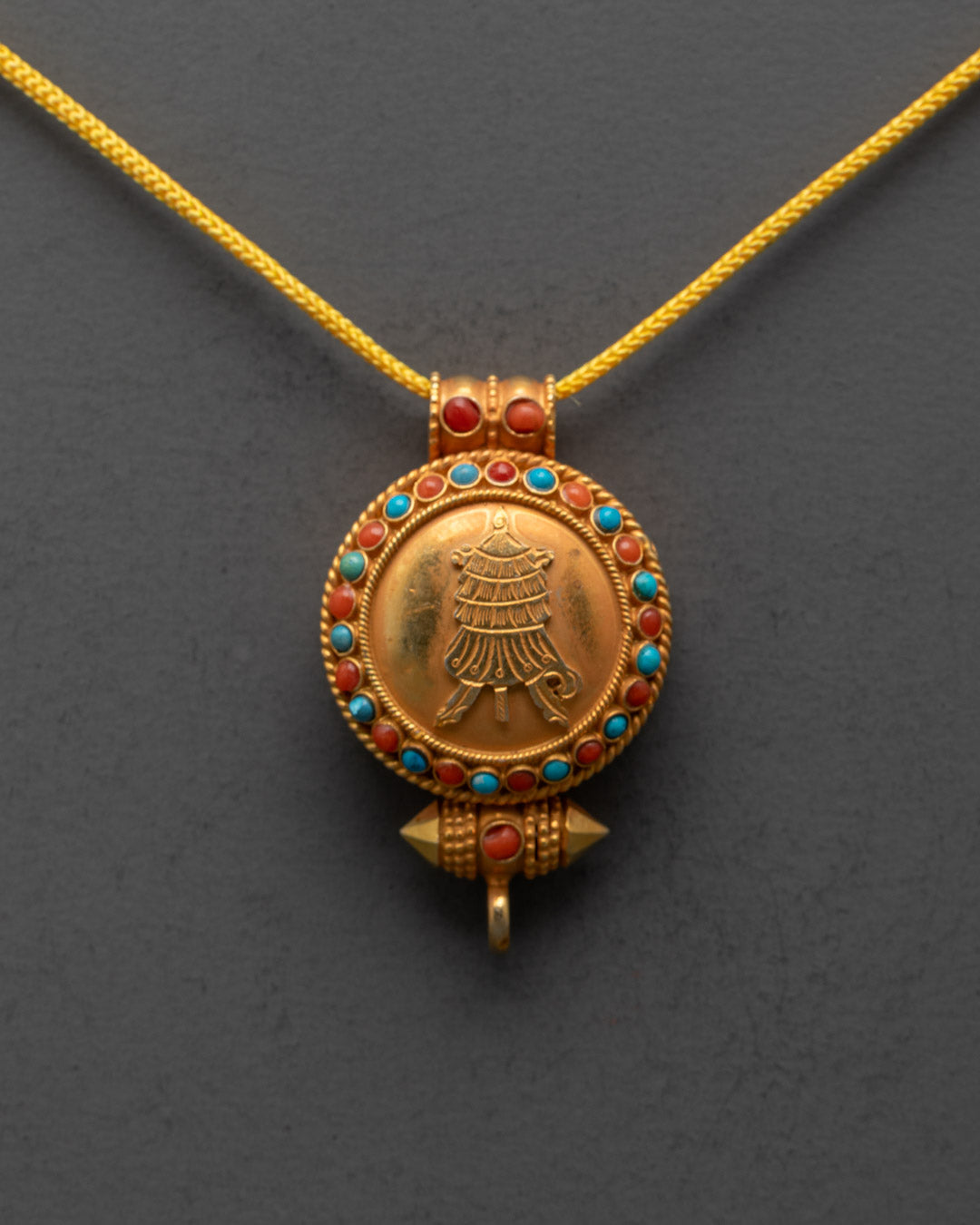 Close-up of intricate Victory Banner design and detailed carvings on the locket