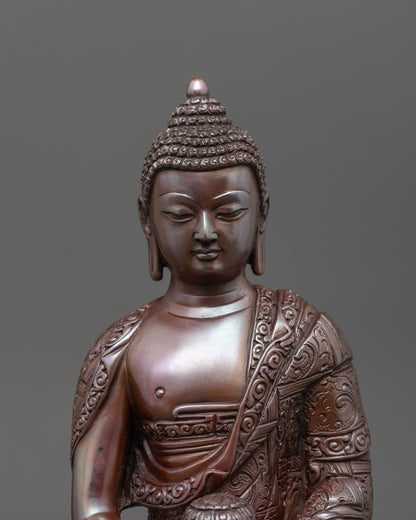 Close-up of intricate carved patterns on oxidized Amitabha Buddha holding monk’s bowl