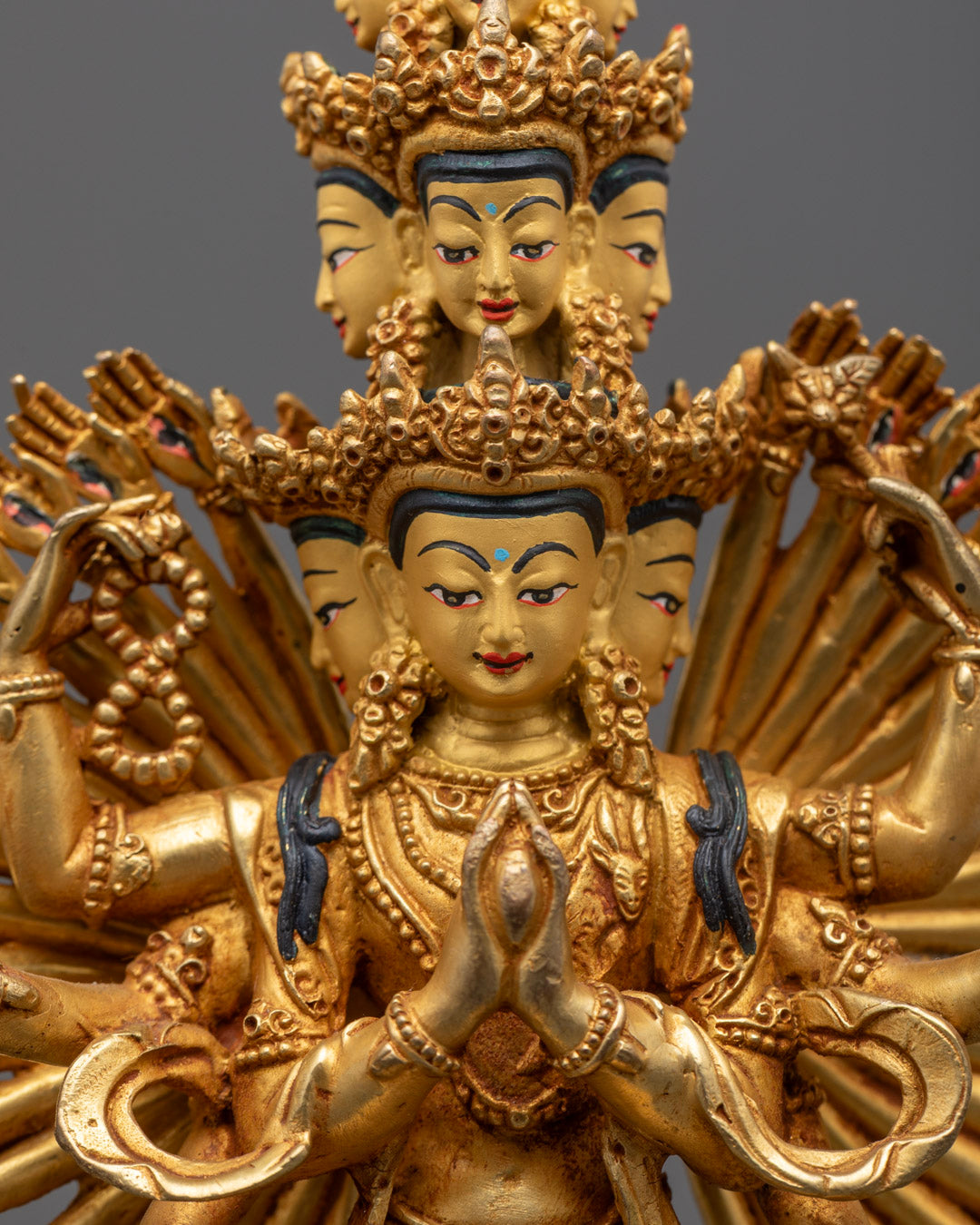 Intricate detailing on 1000 arms and compassionate eyes of the Avalokiteshvara statue – symbolizing boundless compassion in Tibetan Buddhism.