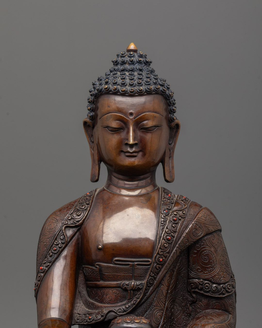 Close-up of intricate details on Shakyamuni Buddha statue from Patan, Nepal