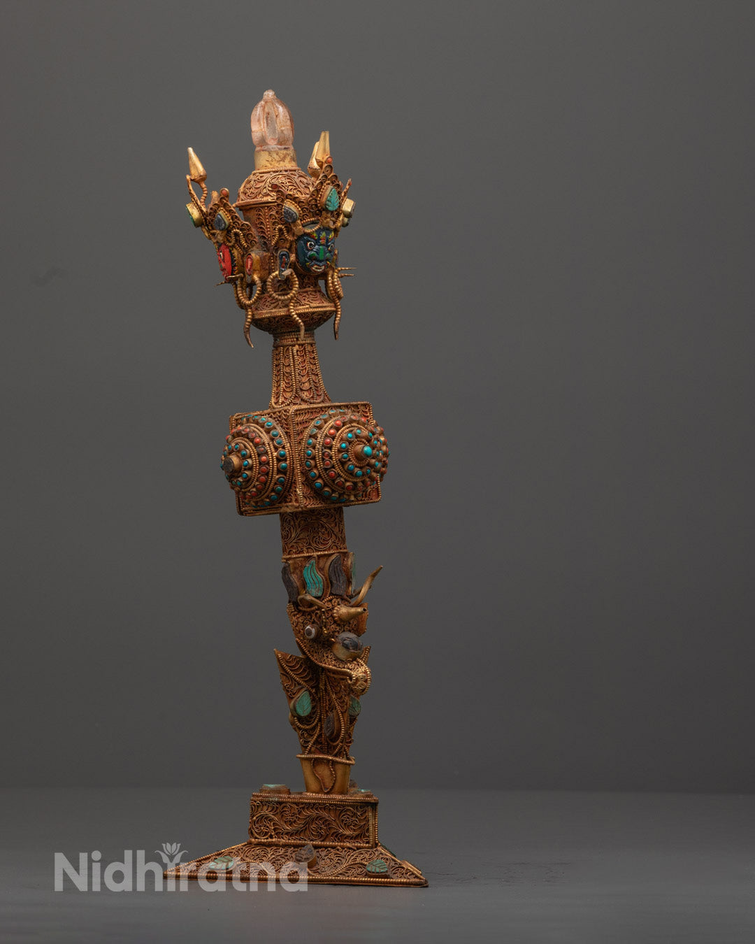 Close-up of intricate details on a traditional Tibetan Phurba ritual dagger 