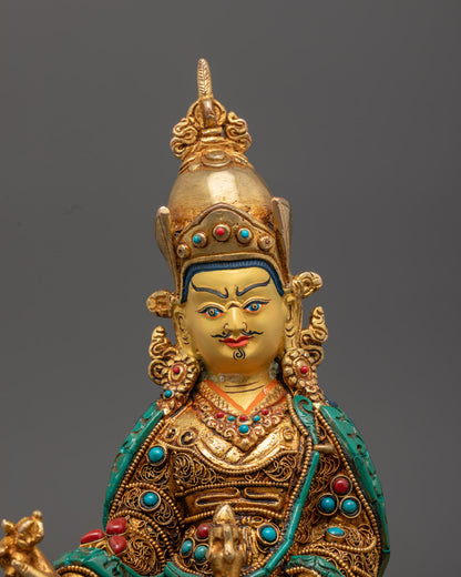 intricate details on the Guru Rinpoche Statue showing vibrant multi-layered acrylic colors and ornate embellishments.