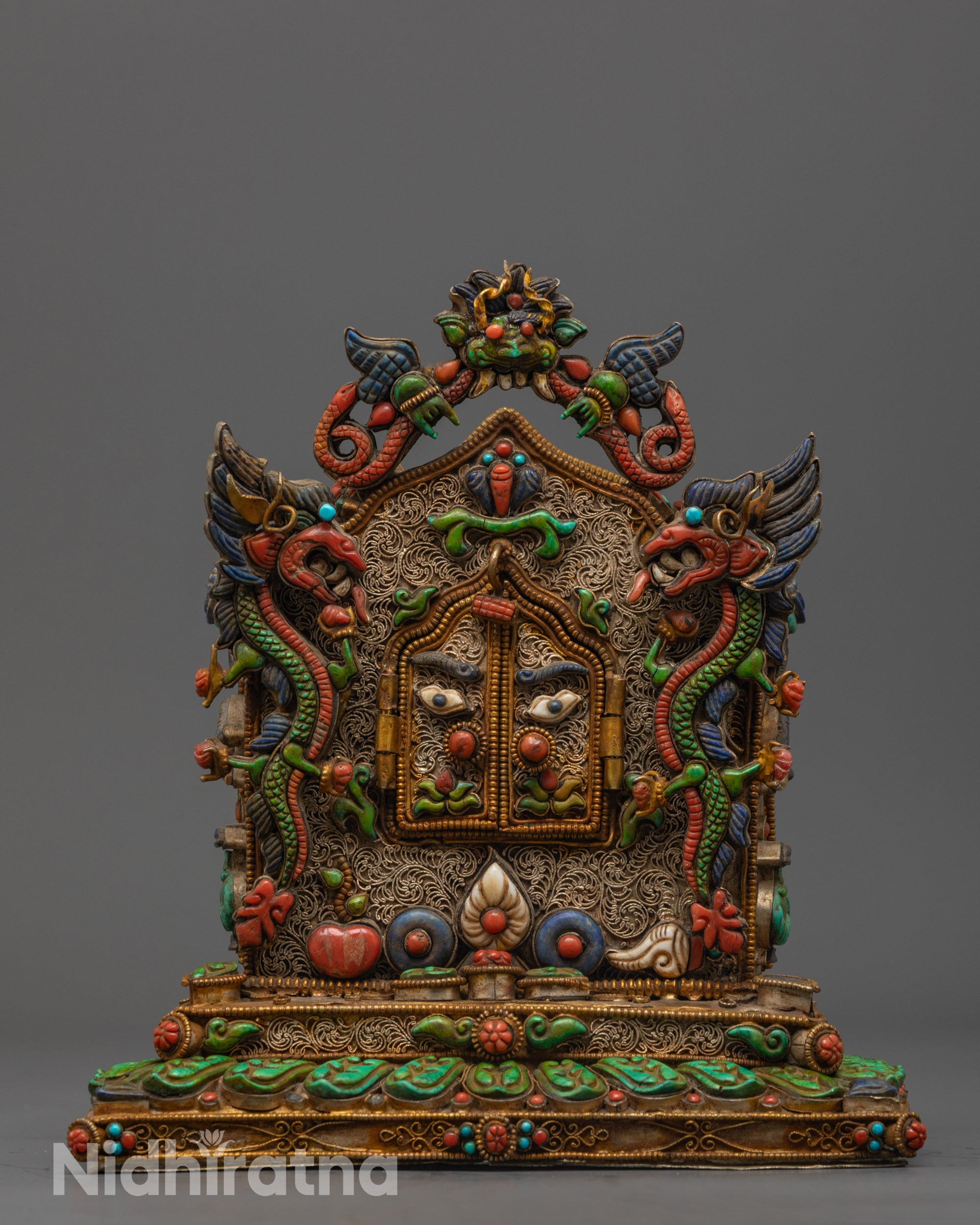 Close-up of intricate filigree patterns and semi-precious stones on Ghau Box