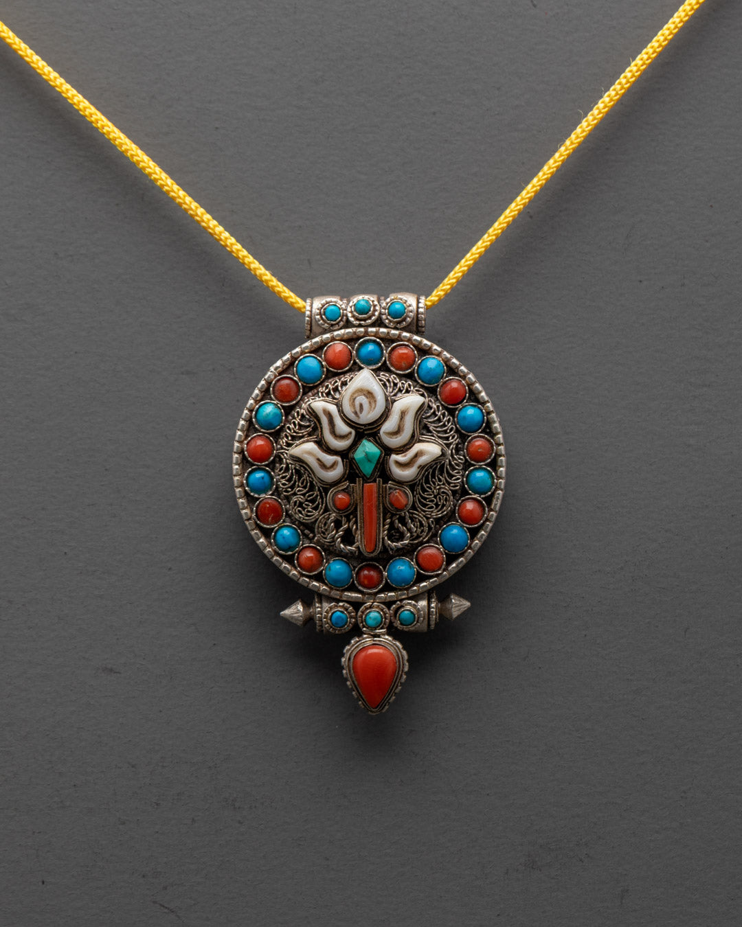 Close-up of intricate silver filigree on Lotus Locket handcrafted in Patan, Nepal
