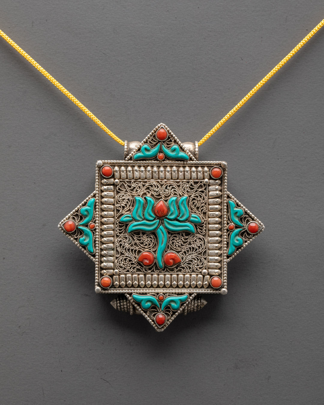 Close-up of intricately carved Lotus Locket from Patan, Nepal showcasing traditional design